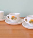 Vintage Milk glass tea cup and saucer with yellow flower