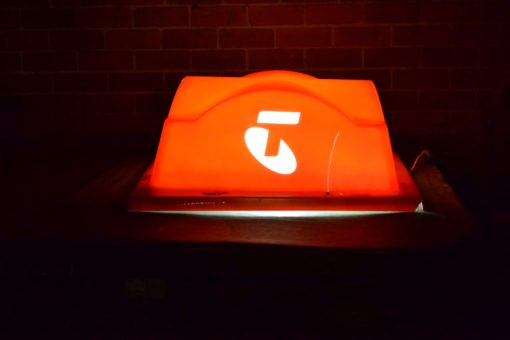 Telstra phone box light orange display