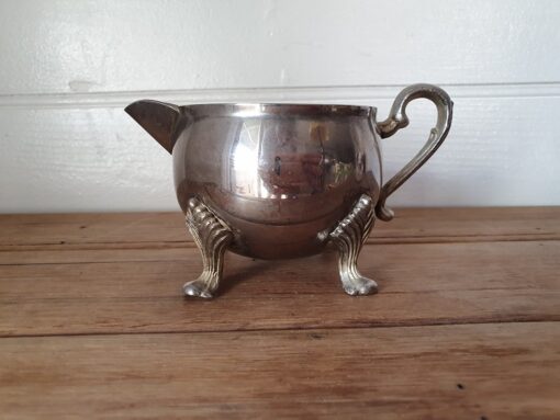 Vintage Sheridan silverplated onto brass creamer , milk jug